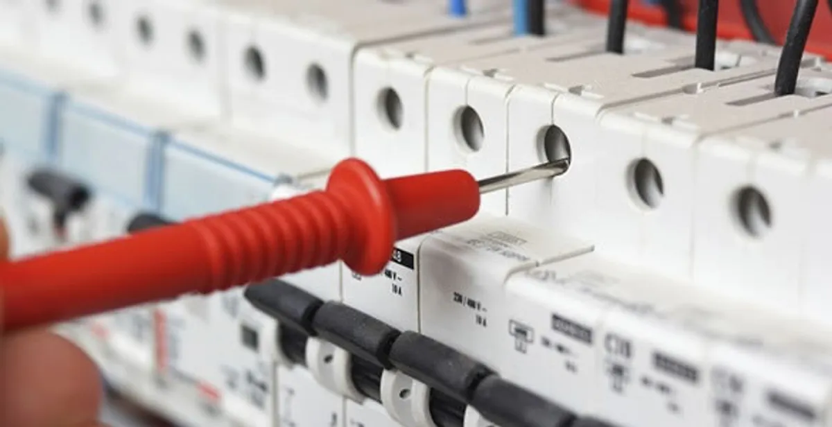 Electrical contractor testing circuit breakers during electrical repair in Windsor, WI