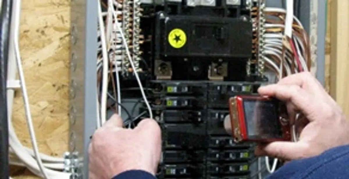 Home electrical inspection of circuit breaker panel by licensed electrician in Madison, WI