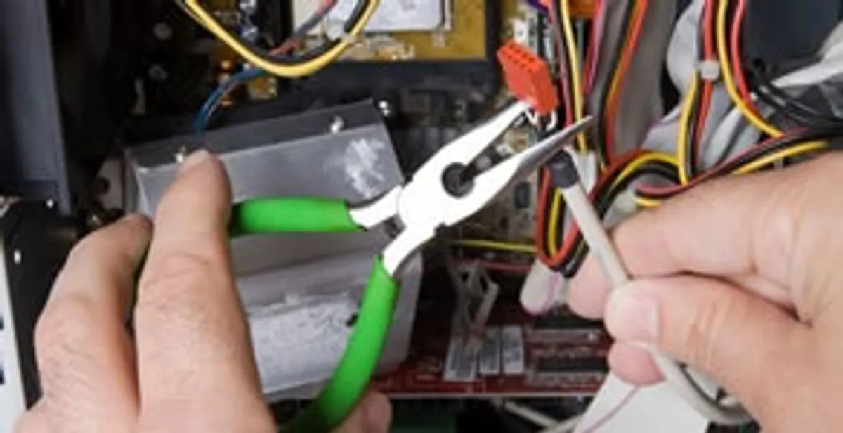 Licensed electrical contractor performing electrical repair with tools in Verona, WI