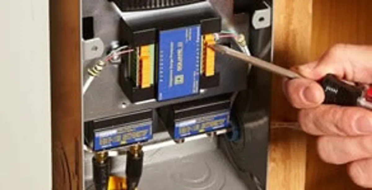 Whole home surge protection device being installed by a licensed electrician to protect electrical systems in Madison, WI